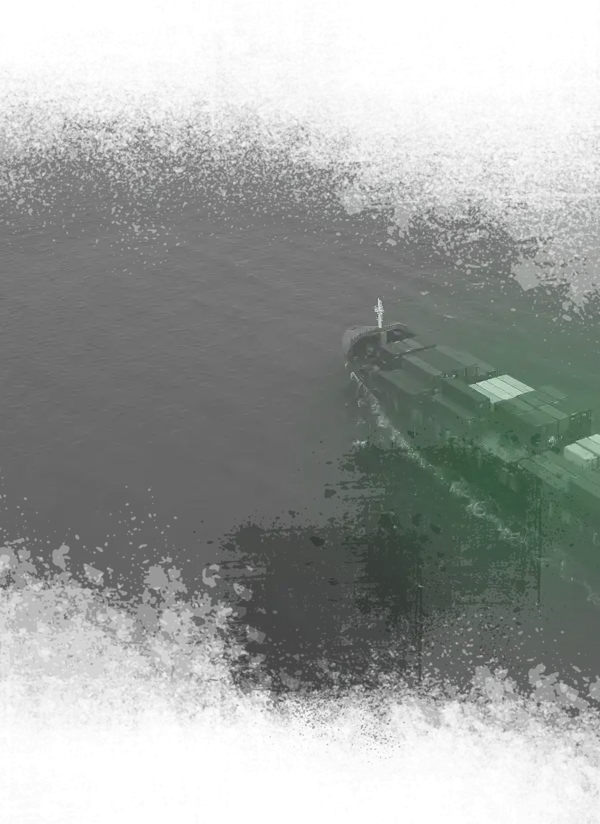 A green light illuminates a ship sailing through the ocean at night, creating a striking contrast against the dark waters.