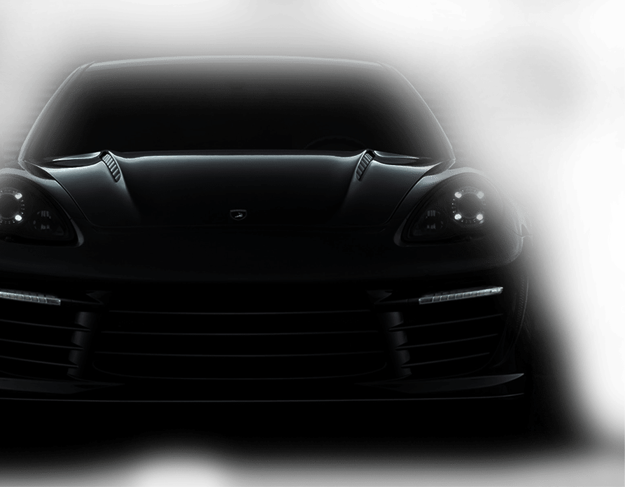 A sleek black Porsche Panamera is displayed, showcasing its modern design and luxurious features.