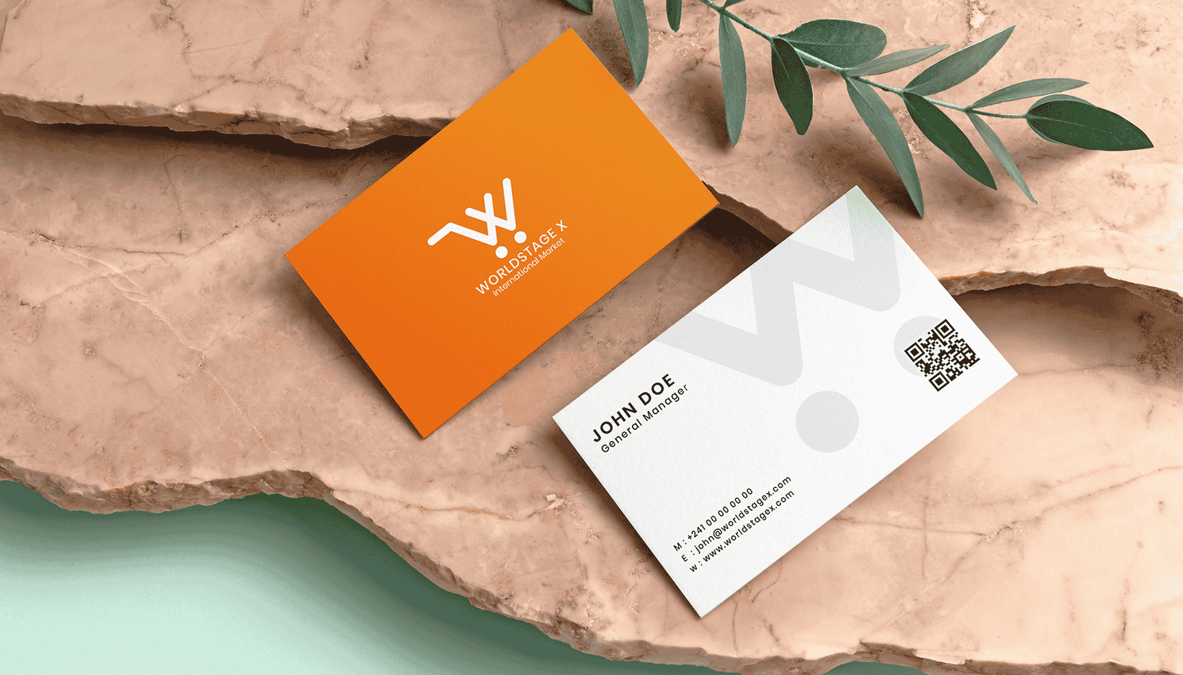 A business card featuring an orange and white logo prominently displayed on its surface