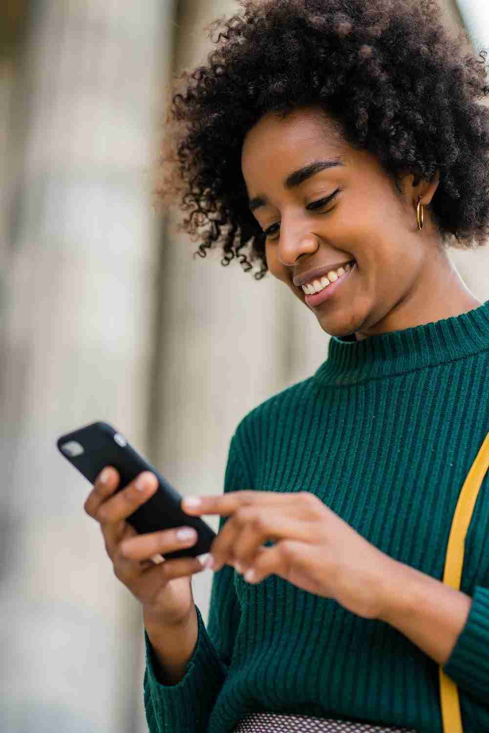 Woman sending money on mobile